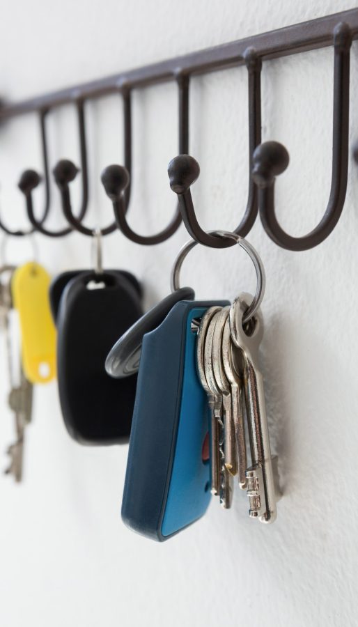 Close-up of various keys hanging on hook